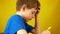 Close up portrait in profile Caucasian preschooler boy draws with marker. The child learns to draw with a felt-tip pen. Drawing le