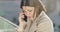 Close-up portrait of sad Caucasian brunette woman talking on the phone. Beautiful stressed businesslady having