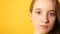 Close-up portrait of sad teenager girl with beautiful gray eyes. Pensive young  woman with gray-blue eyes