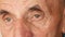 Close up portrait of serious Caucasian elderly man over 70 years old. Human face of an old man with deep wrinkles near the eyes.Se