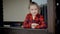 Close up portrait of serious little caucasian girl looking at camera. Adorable preschool kid standing it stands near