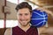 Close up portrait of smiling basketball player holding ball