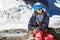 Close up portrait of smiling climber in helmet on mountain