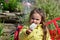 Close up portrait of a smiling girl eating cotton candy at amusement park. little cute girl walks in the park near the