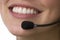 Close-up portrait of a smiling telemarketer