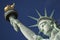 Close-up Portrait of Statue of Liberty Bright Blue Sky Torch