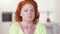 Close-up portrait of stressed beautiful redhead woman having panic attack looking at camera and around. Anxious