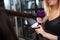 Close-up portrait of stylist drying woman hair in salon