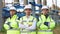 Close up portrait team of young multiethnic group male technician staff wearing a protective helmet and crossing arms