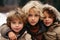 Close-up portrait of three boys in winter outfits with stunning blue eyes during the chilly season