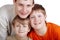 Close-up portrait of three smiling boys