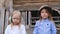 Close-up portrait of two beautiful little girls children posing in dusty helmet