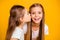 Close-up portrait of two nice cool attractive lovely sweet cheerful cheery positive girlish girls having fun kissing