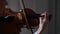 Close-up portrait of woman musician playing the violin in slow motion