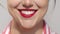 Close up portrait of woman's lips with red lipstick, smiling, showing perfect white teeth. High quality photo image.