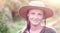 Close-up portrait of a young, beautiful and happy woman in tropical forest. Camp, adventure, trip, hiking concept.