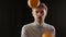 Close up portrait of young caucasian man juggling oranges