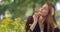 Close Up Portrait Young Charming Beautiful Blonde Girl Smelling Enjoying Touching Stroking Face Using Yellow Flower