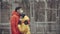 Close-up portrait of young europeans couple in protective disposable medical face mask walking outdoors. New coronavirus COVID-19