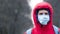 Close-up portrait young europeans man in protective disposable medical face mask walking outdoors. New coronavirus COVID-19