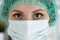 Close-up portrait of young female surgeon doctor
