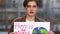 Close up portrait of a young girl student with a poster with the inscription - This is no Planet B. Climate strike