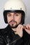 Close-up portrait of young happy biker man with white cafe-racer helmet. White background.