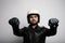 Close-up portrait of young happy biker man with white cafe-racer helmet. White background.