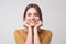 Close up portrait of young happy caucasian woman on white background