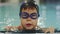 close-up portrait young swimmer boy black swimming cup blue goggles