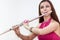 Close up portrait of young woman playing on flute,