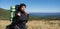 close-up portrait of a young woman tourist with a large backpack. Baner. Mountain landscape.