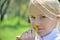 Close-up portraite little girl with dandelion