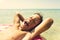 Close up portreit of boy is floating on an inflatable donut ring in the sea. Toned photo