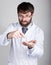 Close-up portret of a Doctor, stethoscope around his neck. He shows a finger in his empty palm, offering to pay