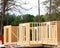 Close-up post, beam and timber framing new suburban wooden house with OSB Oriented Strand Board plywood sheathing Flowery Branch,