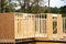 Close-up post, beam and timber framing new suburban wooden house with OSB Oriented Strand Board plywood sheathing Flowery Branch,