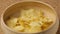Close up of potato chips pouting into bowl