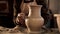 Close up of potter`s hands designing pattern on traditional pottery by chisel with blurry other equipments on desk, clay