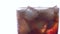 Close up of pour cola on ice cube in glass isolated on white background, beverage and drink