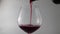 Close up of pour red wine in to a glass
