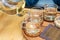 Close up Pour the tea from the kettle into a cup of tea on the table