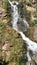 Close-up of a powerful waterfall in the wild in high quality.