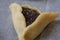 Close up of a prebaked `Haman pocket`, also known as Hamantashen, an Ashkenazi Jewish triangular filled-pocket cookie, usually ass