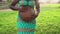 Close up pregnant belly of young African woman in park during sunset time