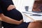 Close Up Of Pregnant Businesswoman In Office