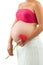 Close up of pregnant woman\'s tummy with flower.