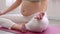 Close up Pregnant Woman sit on yoga mat and doung yoga lotus pose at cozy home,Pregnancy of young woman enjoy with yoga to