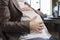 Close up of pregnant woman touching baby bump while in company office workplace.