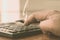 Close up of Press the right button. Calculator with finger. Fingers pressing the buttons of calculator. A businessman typing hand